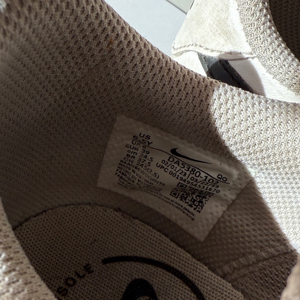 Nike White Sneakers with Black Swoosh and Gold Stripe - Picture 3 of 5